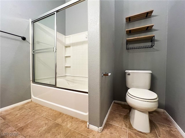 3412 Catherine Mermet Ave, North Las Vegas, NV 89081 - full bathroom featuring toilet, combined bath / shower with glass door, tile patterned flooring, and baseboards
