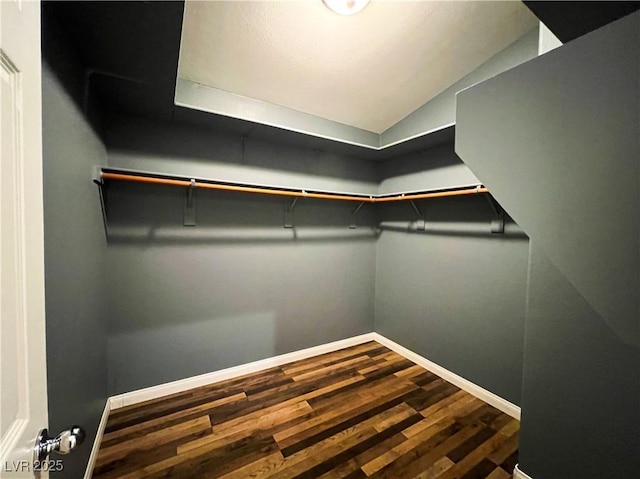 3412 Catherine Mermet Ave, North Las Vegas, NV 89081 - spacious closet featuring dark wood-style flooring and lofted ceiling