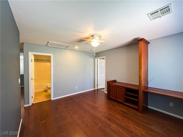 3412 Catherine Mermet Ave, North Las Vegas, NV 89081 - unfurnished bedroom featuring dark wood-style floors, attic access, baseboards, and connected bathroom