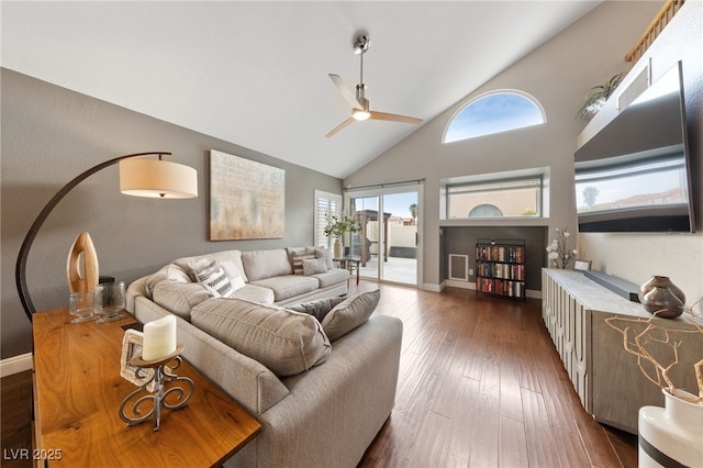 8780 Autumn Wreath Ave, Las Vegas, NV 89129 - living room featuring high vaulted ceiling, ceiling fan, hardwood / wood-style floors, and baseboards