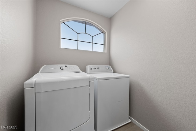 8780 Autumn Wreath Ave, Las Vegas, NV 89129 - laundry area with separate washer and dryer and baseboards