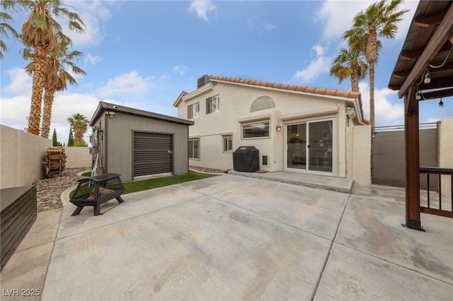 8780 Autumn Wreath Ave, Las Vegas, NV 89129 - back of property featuring a patio area, a fenced backyard, stucco siding, and a tile roof