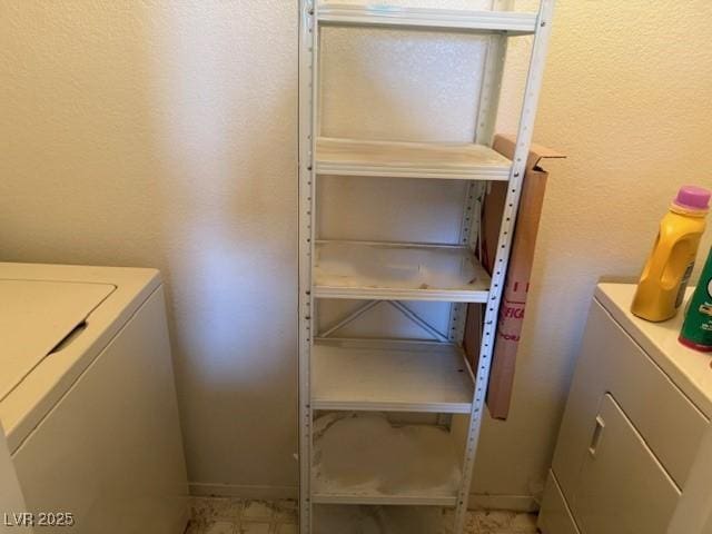 7570 W Flamingo Rd Unit 202, Las Vegas, NV 89147 - laundry room with washer / dryer and a textured wall