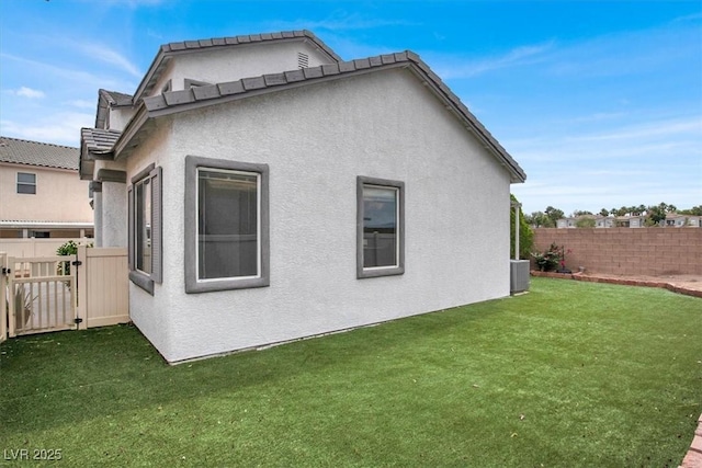 8389 Charlton Valley Ct, Las Vegas, NV 89123 - back of house with stucco siding and cooling unit