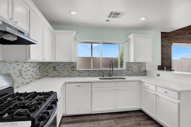 8389 Charlton Valley Ct, Las Vegas, NV 89123 - kitchen with dishwasher, a sink, stainless steel gas range oven, under cabinet range hood, and white cabinets