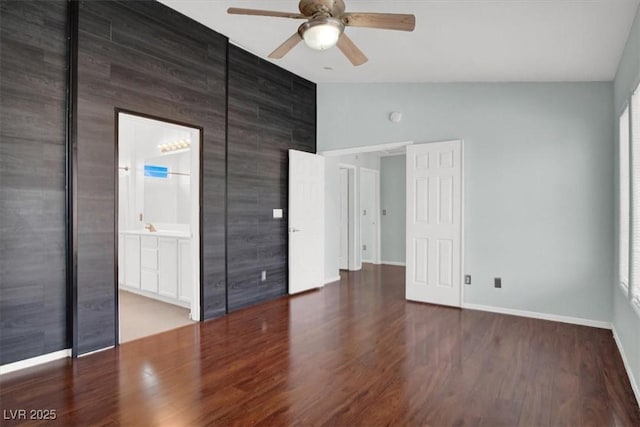 8389 Charlton Valley Ct, Las Vegas, NV 89123 - unfurnished bedroom featuring lofted ceiling, wood finished floors, baseboards, a ceiling fan, and multiple windows