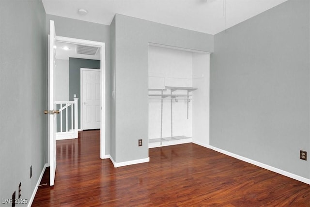 8389 Charlton Valley Ct, Las Vegas, NV 89123 - unfurnished bedroom with wood finished floors, a closet, and baseboards