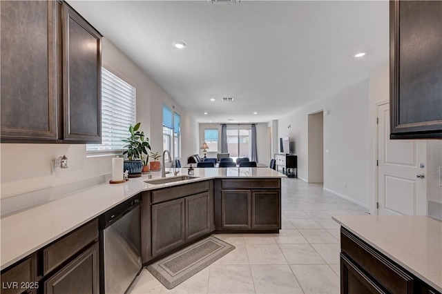 4293 Nopal Serrano Ave, Las Vegas, NV 89141 - kitchen with stainless steel dishwasher, a sink, a peninsula, dark brown cabinetry, and recessed lighting