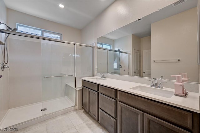 4293 Nopal Serrano Ave, Las Vegas, NV 89141 - full bathroom with a stall shower, double vanity, tile patterned flooring, and recessed lighting