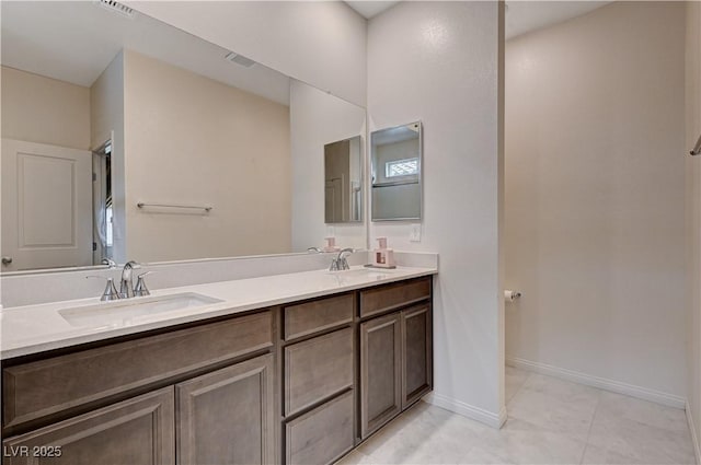 4293 Nopal Serrano Ave, Las Vegas, NV 89141 - full bathroom featuring double vanity, tile patterned flooring, and baseboards