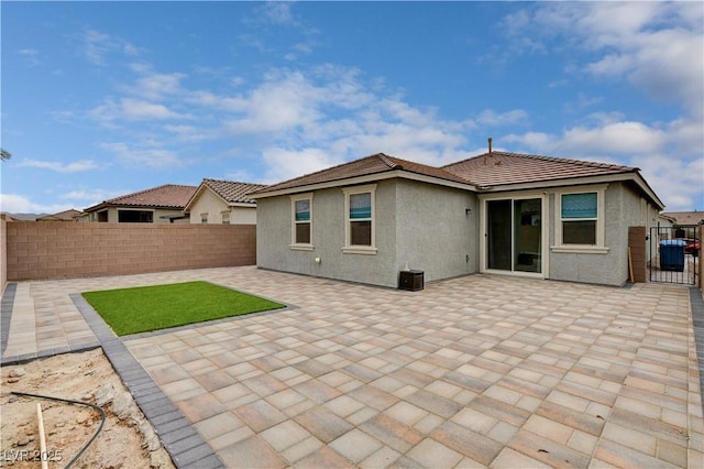 4293 Nopal Serrano Ave, Las Vegas, NV 89141 - rear view of house with a fenced backyard, stucco siding, and a patio