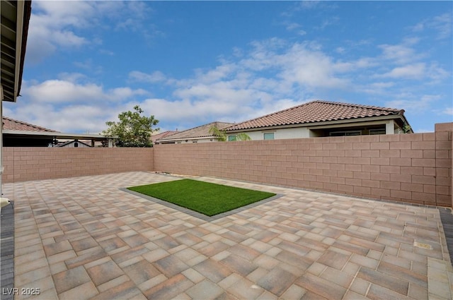 4293 Nopal Serrano Ave, Las Vegas, NV 89141 - fenced backyard with a patio area