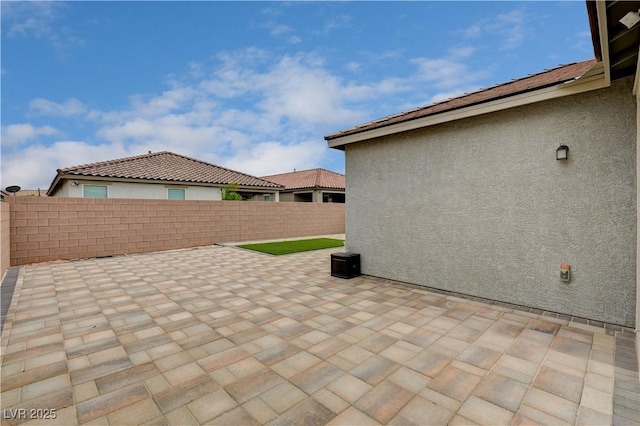 4293 Nopal Serrano Ave, Las Vegas, NV 89141 - fenced backyard featuring a patio area