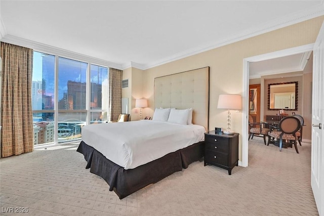 135 E Harmon Ave Unit 1401, Las Vegas, NV 89109 - bedroom with light colored carpet, a wall of windows, multiple windows, and crown molding