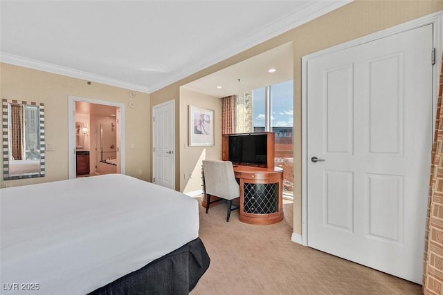 135 E Harmon Ave Unit 1401, Las Vegas, NV 89109 - bedroom with crown molding, ensuite bathroom, baseboards, and light colored carpet
