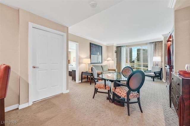 135 E Harmon Ave Unit 1401, Las Vegas, NV 89109 - dining area featuring baseboards, light colored carpet, and ornamental molding