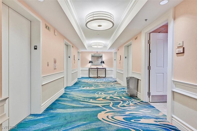 135 E Harmon Ave Unit 1401, Las Vegas, NV 89109 - corridor featuring elevator, a tray ceiling, carpet floors, and ornamental molding