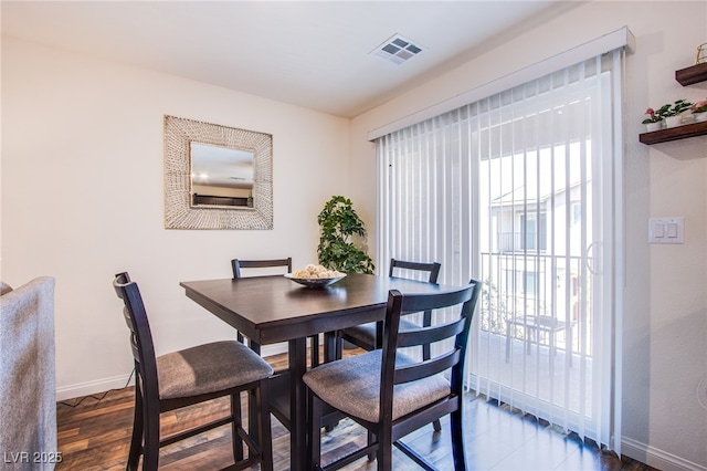 6819 Citron Mist Ct, North Las Vegas, NV 89086 - dining space featuring baseboards and wood finished floors