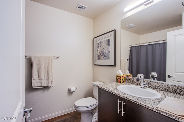 6819 Citron Mist Ct, North Las Vegas, NV 89086 - bathroom with vanity, toilet, baseboards, wood finished floors, and a shower with shower curtain