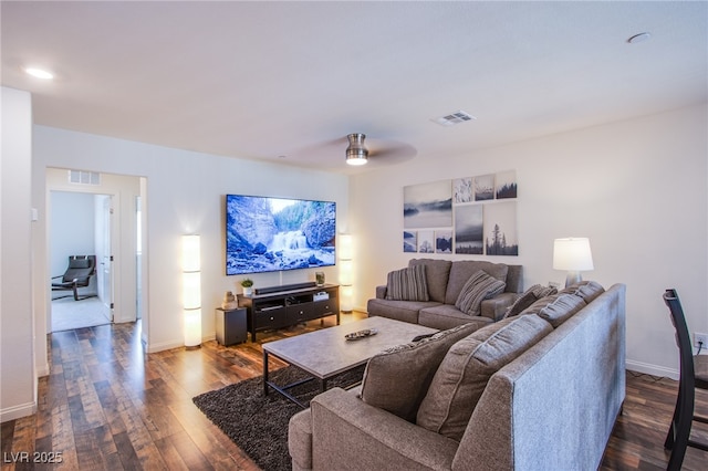 6819 Citron Mist Ct, North Las Vegas, NV 89086 - living area featuring dark wood-type flooring, baseboards, and a ceiling fan