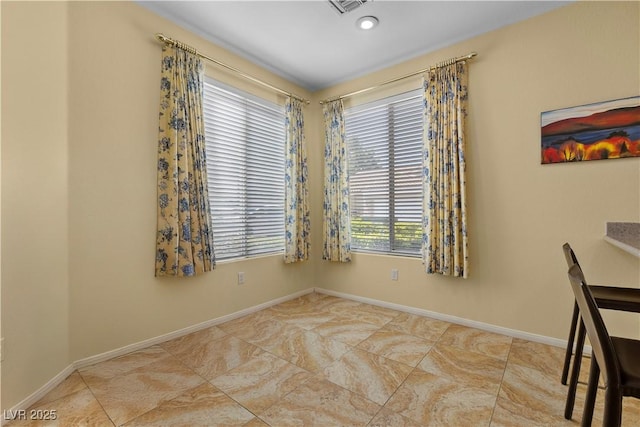 2033 Summer Spruce Pl Unit 102, Las Vegas, NV 89134 - unfurnished dining area with baseboards