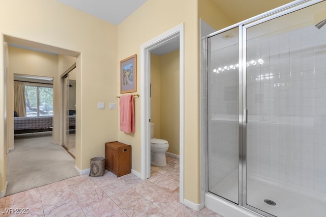 2033 Summer Spruce Pl Unit 102, Las Vegas, NV 89134 - bathroom with a shower stall, toilet, and baseboards