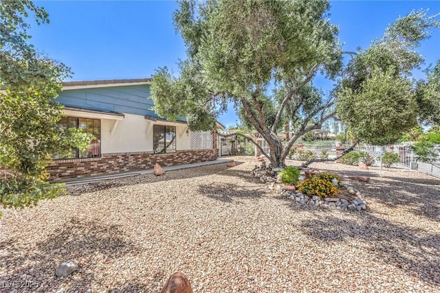 2045 S Tenaya Way, Las Vegas, NV 89117 - view of side of home with brick siding