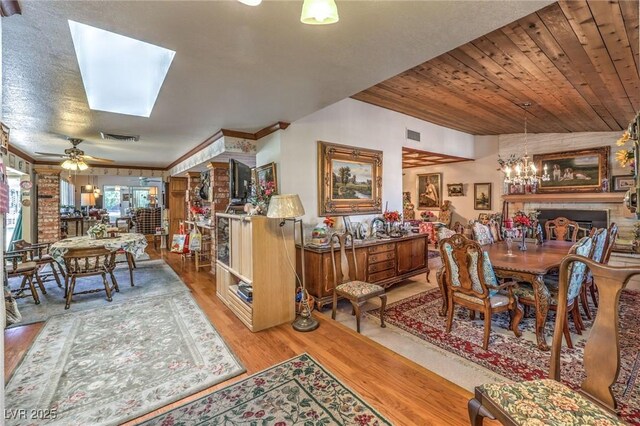 2045 S Tenaya Way, Las Vegas, NV 89117 - dining area featuring wood finished floors, a chandelier, ceiling fan, and crown molding