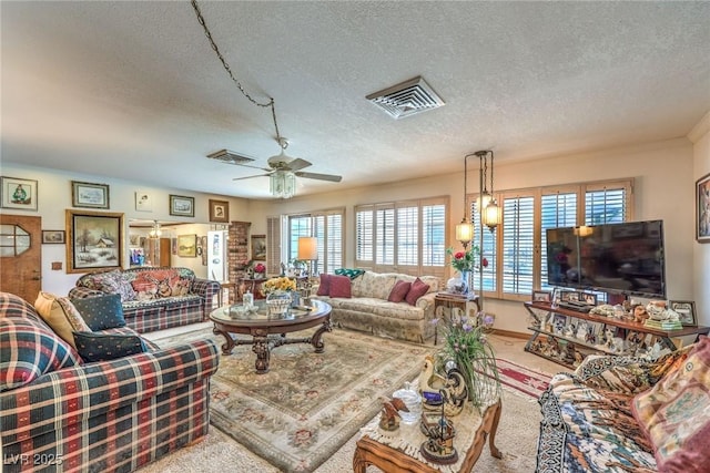 2045 S Tenaya Way, Las Vegas, NV 89117 - living room featuring a textured ceiling, carpet floors, plenty of natural light, and ceiling fan
