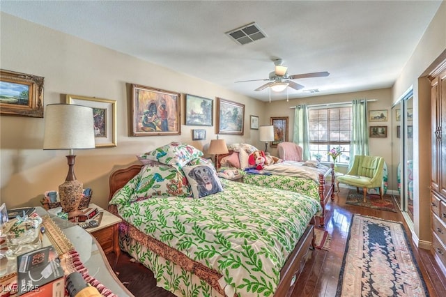 2045 S Tenaya Way, Las Vegas, NV 89117 - bedroom with dark wood-type flooring and a ceiling fan