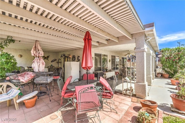 2045 S Tenaya Way, Las Vegas, NV 89117 - view of patio featuring outdoor dining area and ceiling fan