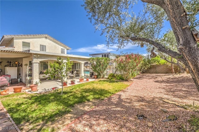 2045 S Tenaya Way, Las Vegas, NV 89117 - back of house featuring a patio and stucco siding