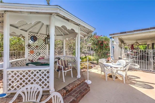 2045 S Tenaya Way, Las Vegas, NV 89117 - view of patio featuring a gazebo, a ceiling fan, and outdoor dining space
