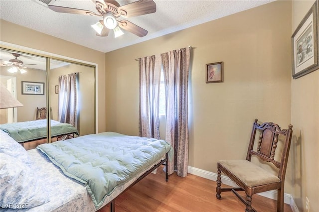2045 S Tenaya Way, Las Vegas, NV 89117 - bedroom featuring a closet, light wood finished floors, baseboards, ceiling fan, and a textured ceiling
