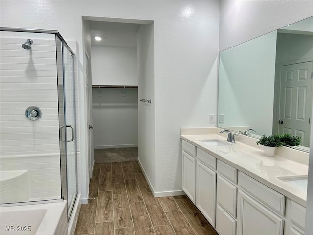 965 Nevada State Dr Unit 39102, Henderson, NV 89002 - full bath featuring a stall shower, wood finished floors, double vanity, and a walk in closet