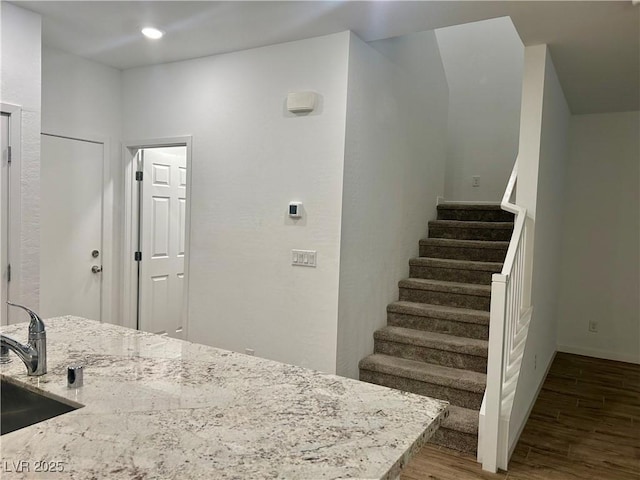 965 Nevada State Dr Unit 39102, Henderson, NV 89002 - kitchen with wood finished floors, light stone counters, and recessed lighting