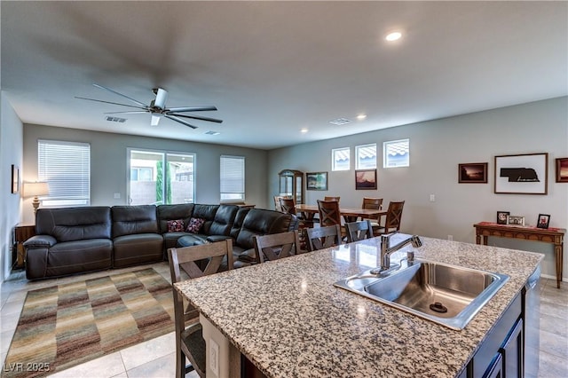 5854 Olivine Falls Ave, Las Vegas, NV 89130 - kitchen featuring a sink, recessed lighting, a ceiling fan, a center island with sink, and open floor plan