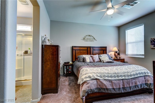 5854 Olivine Falls Ave, Las Vegas, NV 89130 - bedroom featuring multiple windows, carpet floors, connected bathroom, and ceiling fan