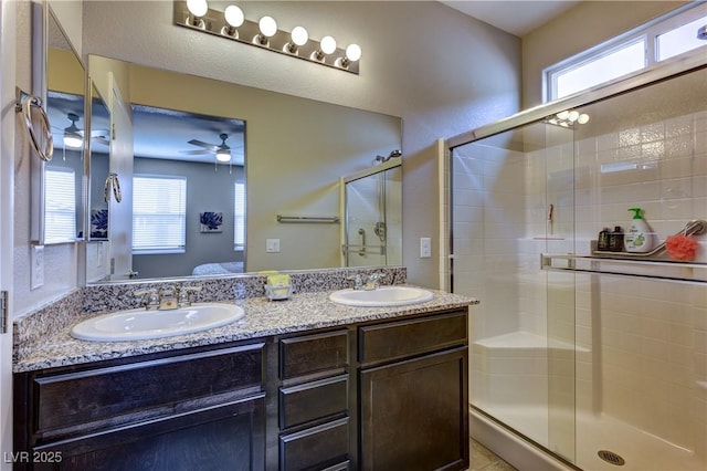 5854 Olivine Falls Ave, Las Vegas, NV 89130 - ensuite bathroom with a stall shower, double vanity, ceiling fan, and healthy amount of natural light