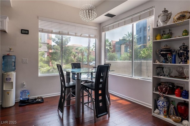 35 E Agate Ave Unit 208, Las Vegas, NV 89123 - dining area featuring dark wood-style floors, healthy amount of natural light, and a chandelier