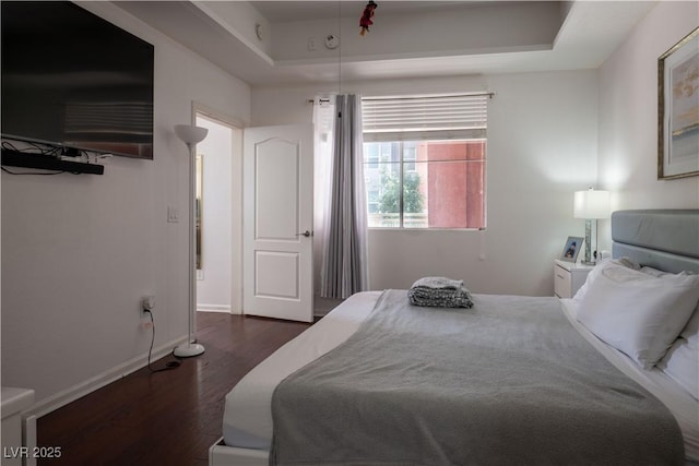 35 E Agate Ave Unit 208, Las Vegas, NV 89123 - bedroom with wood finished floors and a tray ceiling
