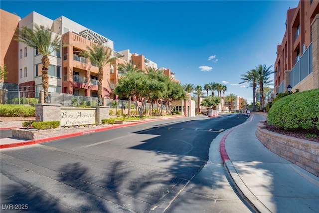 35 E Agate Ave Unit 208, Las Vegas, NV 89123 - view of asphalt road with sidewalks and curbs