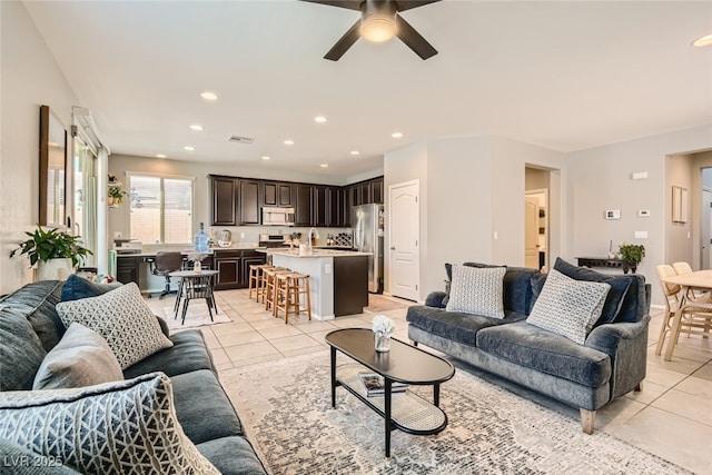 7761 Sagamore Bay Ct, Las Vegas, NV 89179 - living room with light tile patterned flooring, ceiling fan, and recessed lighting