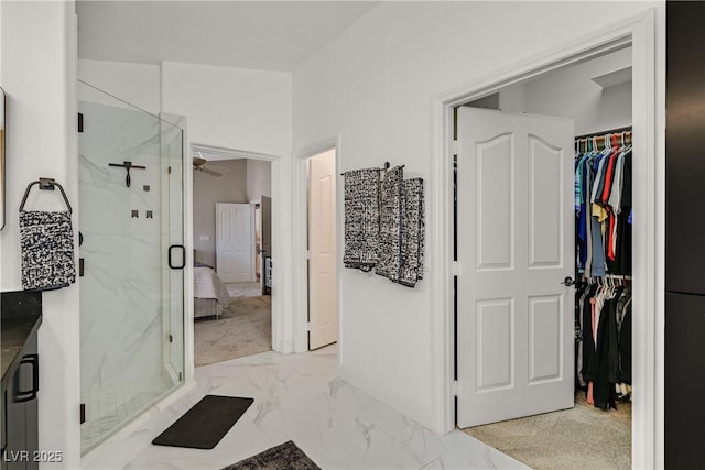 1780 Crystal Stream Ave, Henderson, NV 89012 - full bathroom featuring marble finish flooring, a ceiling fan, a marble finish shower, and a spacious closet