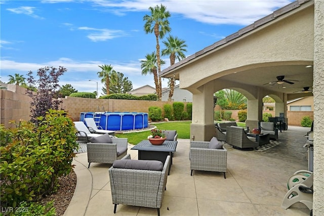 1780 Crystal Stream Ave, Henderson, NV 89012 - fenced backyard featuring an outdoor living space, ceiling fan, and a patio area
