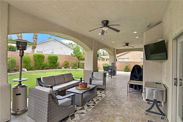 1780 Crystal Stream Ave, Henderson, NV 89012 - fenced backyard featuring an outdoor living space, a patio, and a ceiling fan