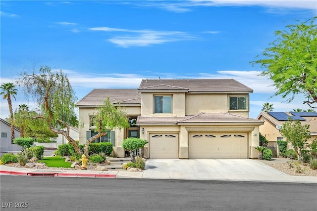 1780 Crystal Stream Ave, Henderson, NV 89012 - traditional-style house featuring stucco siding, a garage, driveway, and a tiled roof