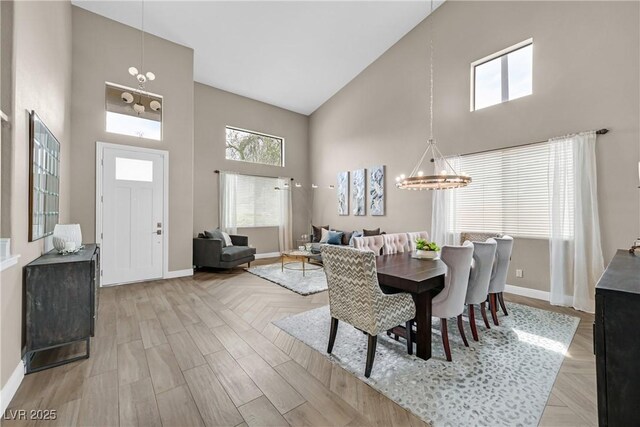 1780 Crystal Stream Ave, Henderson, NV 89012 - dining space with high vaulted ceiling and a chandelier