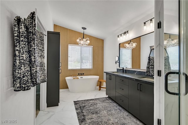 1780 Crystal Stream Ave, Henderson, NV 89012 - full bath featuring wood walls, a chandelier, double vanity, marble finish flooring, and a freestanding tub