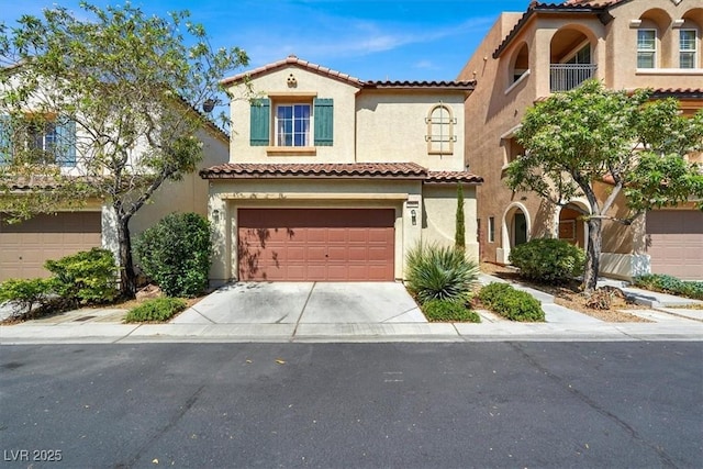 9869 Lime Tree St, Las Vegas, NV 89178 - mediterranean / spanish house featuring stucco siding, an attached garage, a tile roof, and concrete driveway
